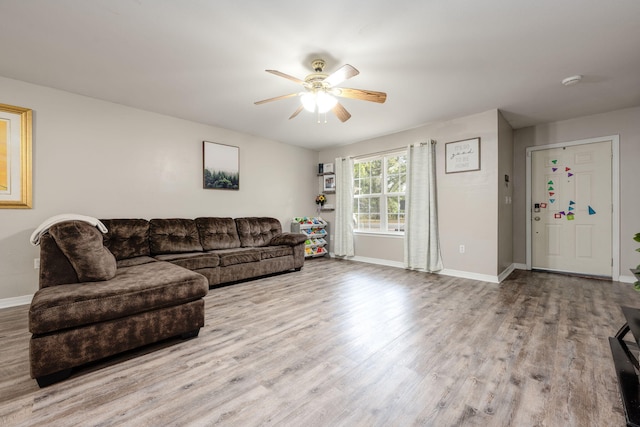 706 Brock Ave, Crestview, FL 32539 - living area featuring ceiling fan, baseboards, and wood finished floors