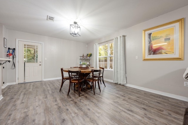 706 Brock Ave, Crestview, FL 32539 - dining space featuring wood finished floors, healthy amount of natural light, and baseboards