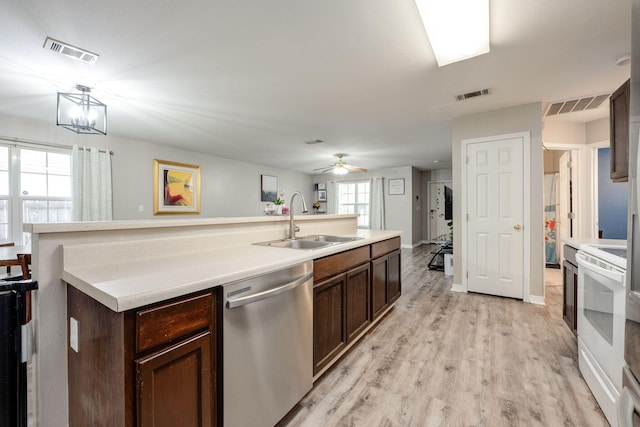 706 Brock Ave, Crestview, FL 32539 - kitchen with a sink, stainless steel dishwasher, white range with electric stovetop, and dark brown cabinetry