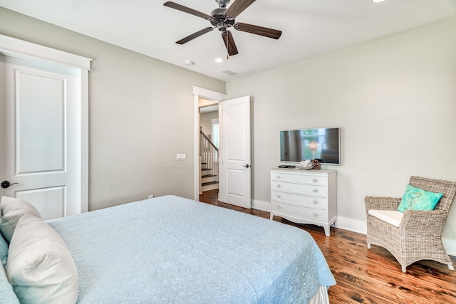 bedroom featuring dark wood-type flooring and ceiling fan