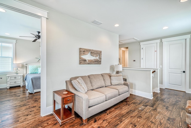 living room with dark hardwood / wood-style floors and ceiling fan