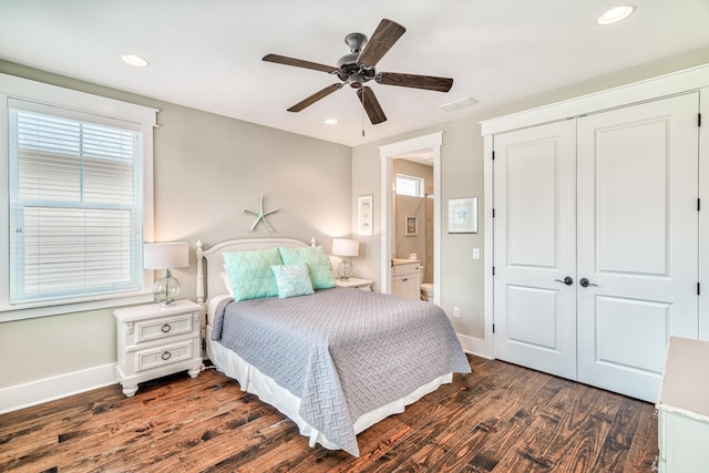 bedroom featuring a closet, ceiling fan, connected bathroom, and dark hardwood / wood-style floors