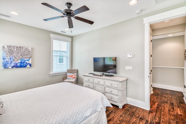 bedroom with ceiling fan and dark hardwood / wood-style flooring