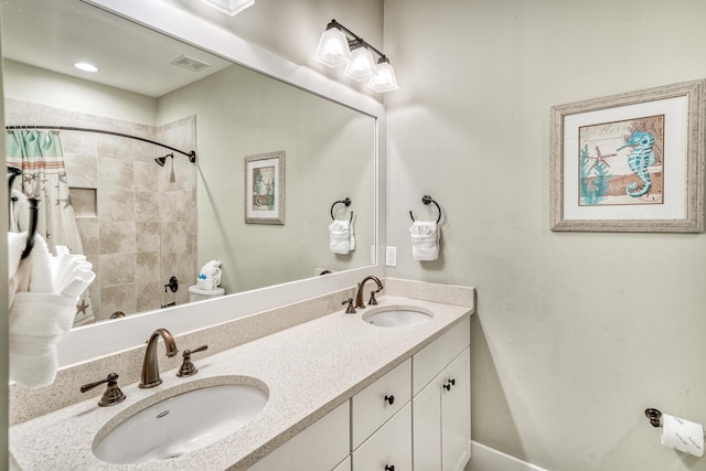 bathroom with vanity and walk in shower