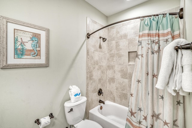 bathroom featuring shower / bath combo and toilet