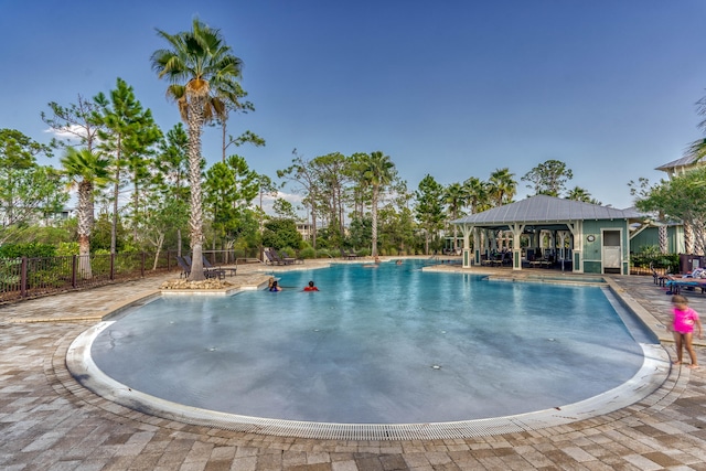 view of swimming pool with a patio