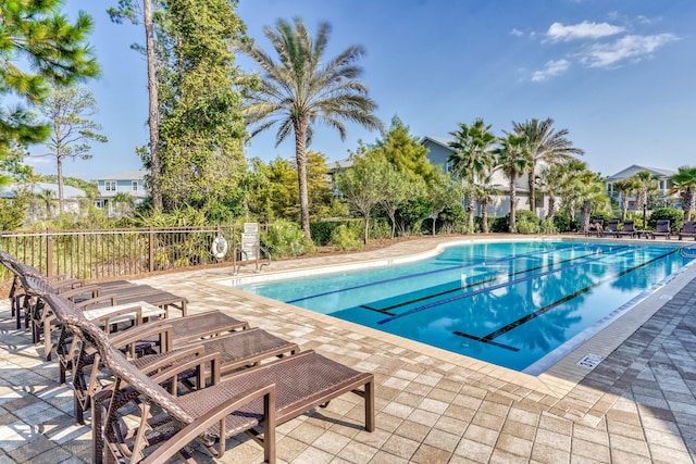 view of swimming pool with a patio area