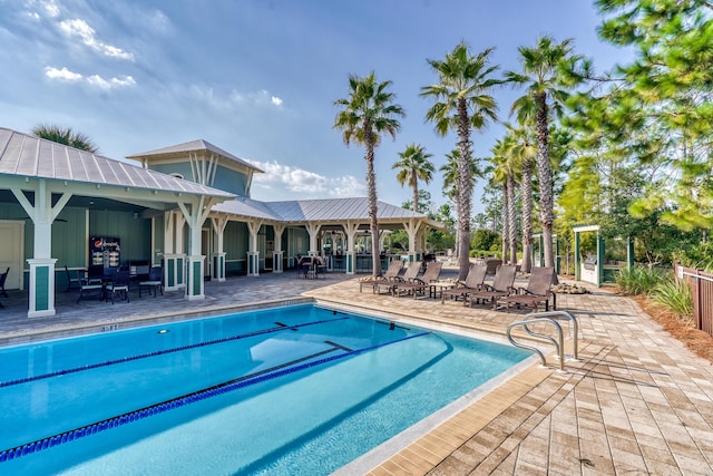 view of swimming pool featuring a patio area