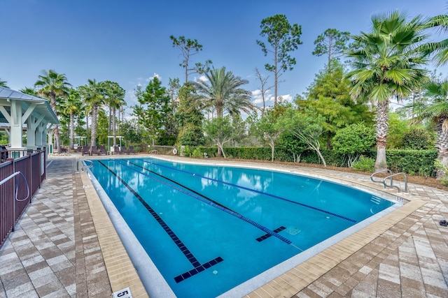 view of swimming pool with a patio area