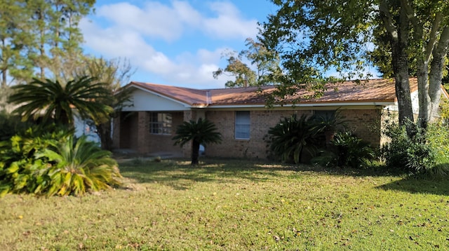 view of home's exterior featuring a yard