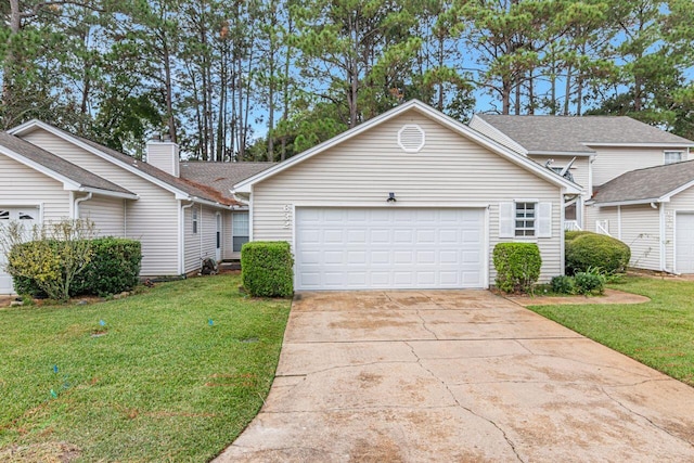 view of front facade featuring a garage and a front lawn