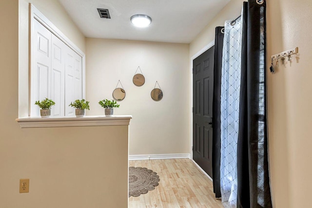 entrance foyer with light hardwood / wood-style flooring