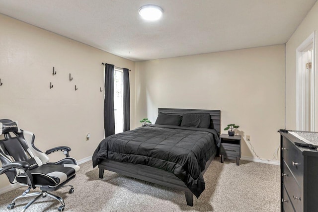 bedroom featuring light colored carpet