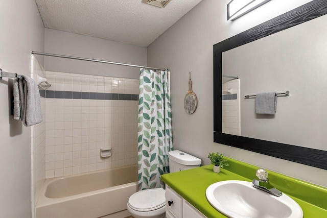 full bathroom with toilet, shower / tub combo, vanity, and a textured ceiling