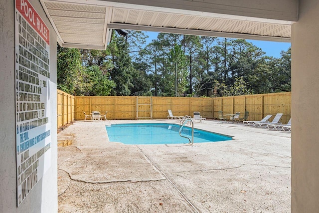 view of swimming pool with a patio area