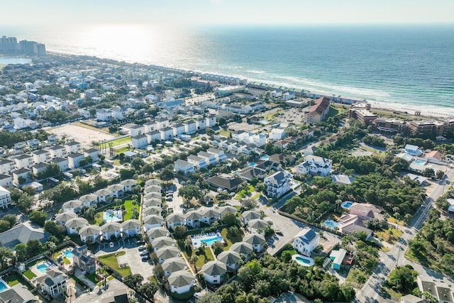 aerial view with a water view and a beach view