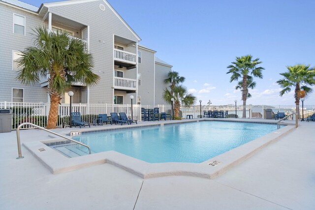 view of swimming pool featuring a patio area