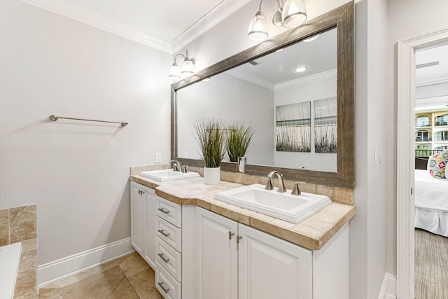 bathroom with tile patterned floors, vanity, and ornamental molding