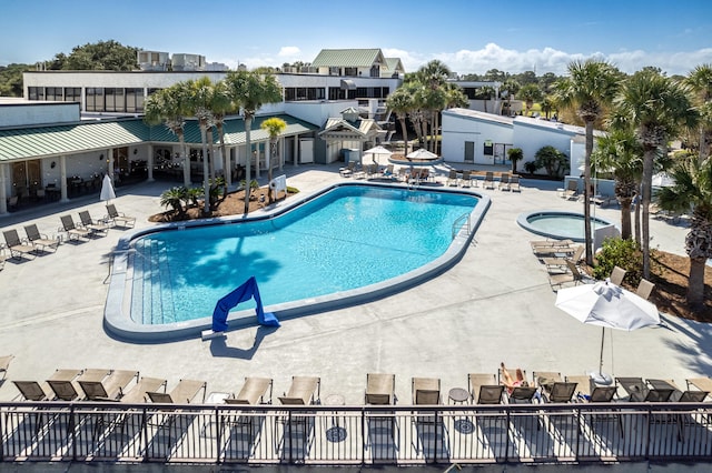 view of pool featuring a patio and a community hot tub