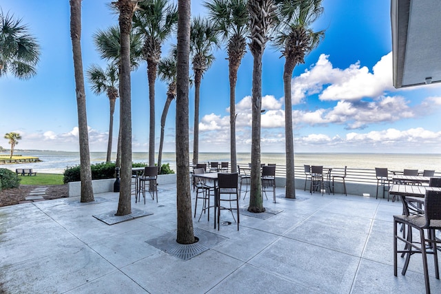 view of patio featuring a water view