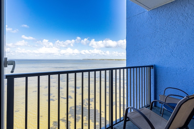 balcony featuring a water view