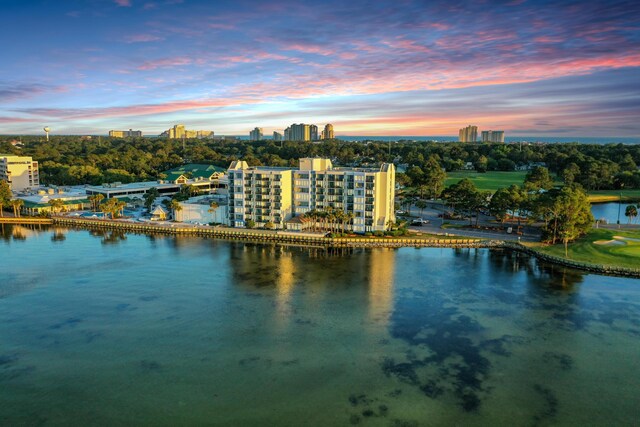 aerial view at dusk with a water view