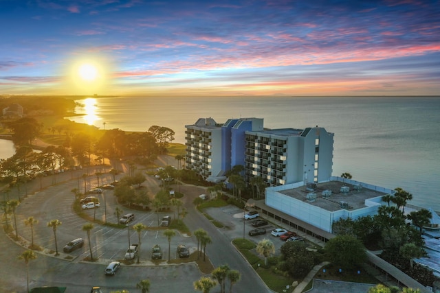 aerial view at dusk with a water view