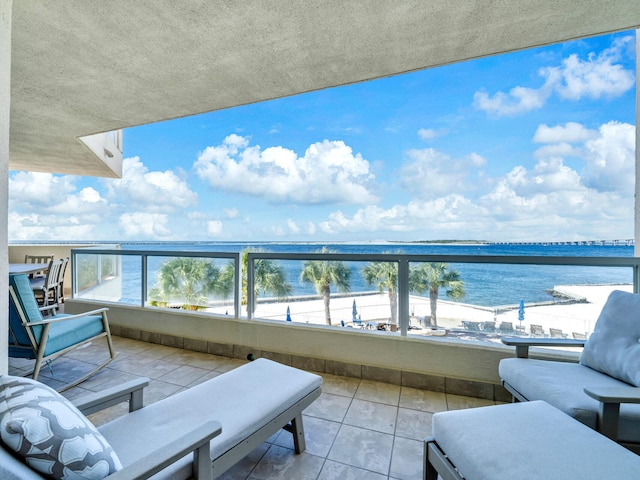 balcony featuring a water view