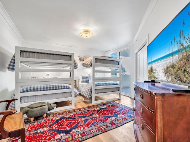 110 Gulf Shore Dr Unit 221, Destin, FL 32541 - bedroom featuring crown molding and light wood finished floors
