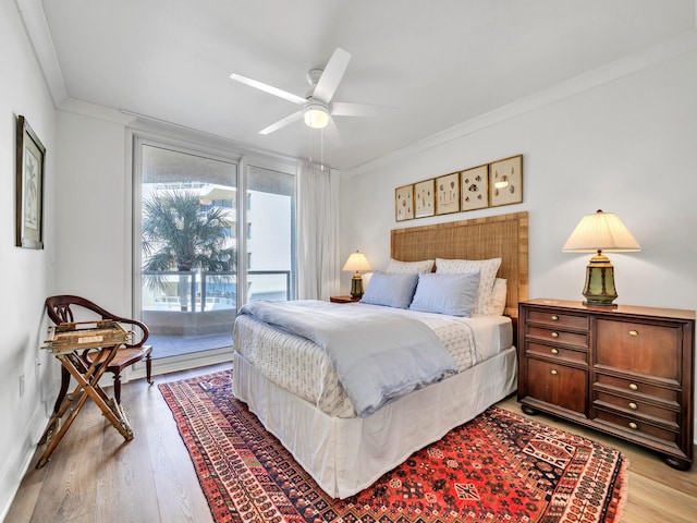 bedroom featuring ornamental molding, access to outside, ceiling fan, and light wood-type flooring