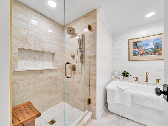 110 Gulf Shore Dr Unit 221, Destin, FL 32541 - bathroom featuring a shower stall, a soaking tub, recessed lighting, and tile patterned flooring