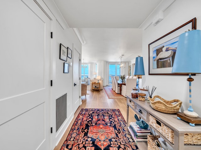 hall with light hardwood / wood-style floors