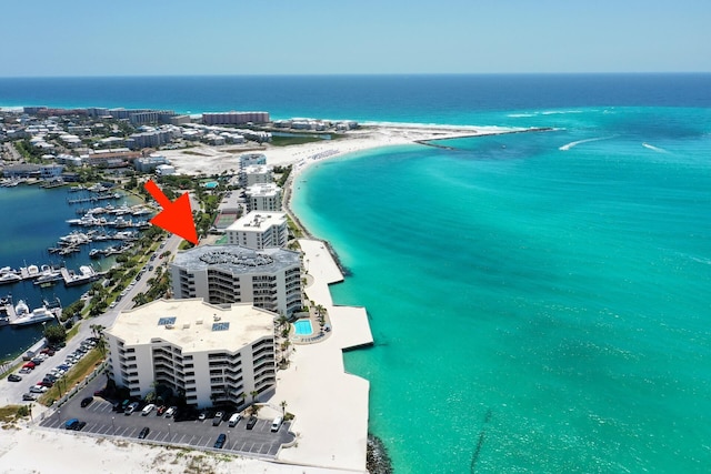 aerial view with a water view and a view of the beach