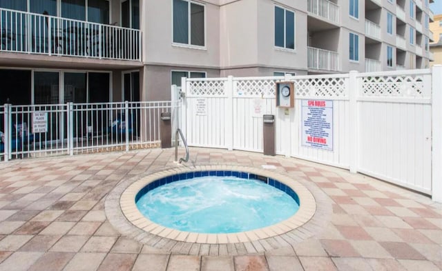 520 Santa Rosa Blvd Unit 100, Fort Walton Beach, FL 32548 - view of swimming pool featuring a hot tub