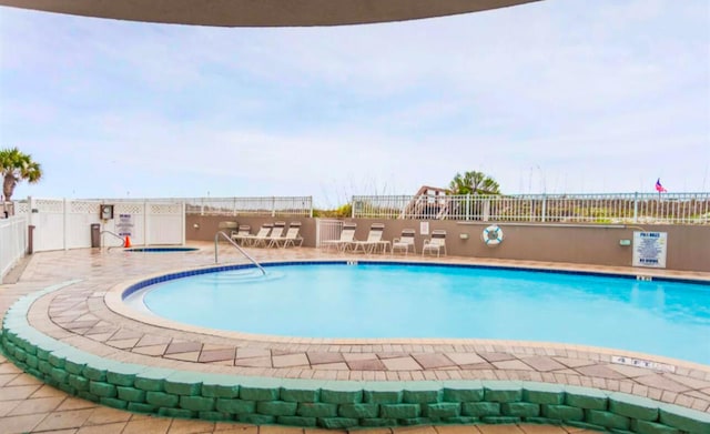 view of pool featuring a patio area