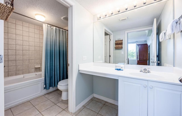 full bathroom with shower / bath combination with curtain, a textured ceiling, vanity, tile patterned floors, and toilet