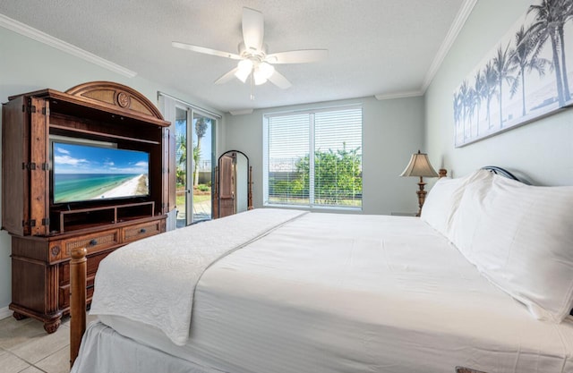 tiled bedroom featuring ornamental molding, access to outside, a textured ceiling, and ceiling fan