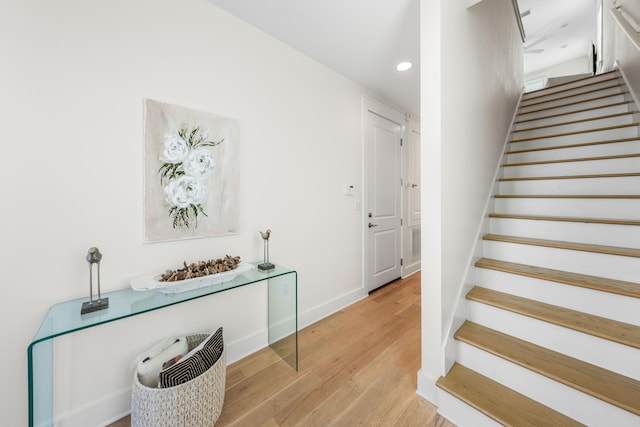 stairs with wood-type flooring