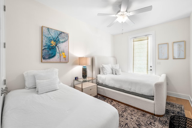 bedroom with hardwood / wood-style floors and ceiling fan