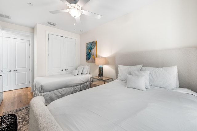 bedroom featuring hardwood / wood-style floors and ceiling fan