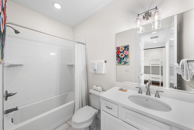 full bathroom with shower / tub combo with curtain, vanity, toilet, and tile patterned floors