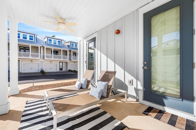 sunroom / solarium with wooden ceiling and ceiling fan