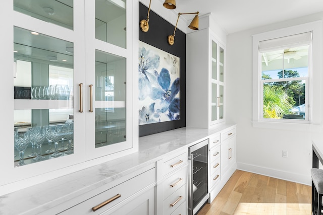 interior space with light wood-type flooring and wine cooler