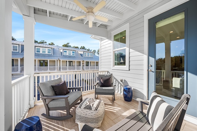 wooden terrace featuring ceiling fan