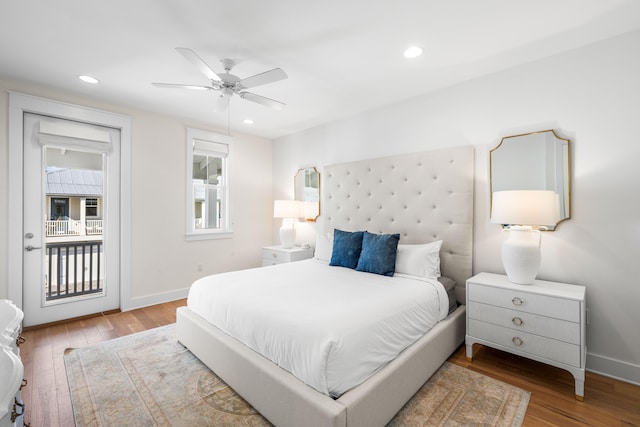 bedroom with access to outside, hardwood / wood-style floors, and ceiling fan