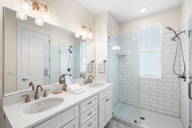 bathroom with vanity and an enclosed shower