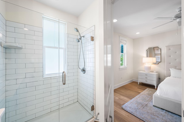 bathroom featuring an enclosed shower, hardwood / wood-style flooring, and ceiling fan