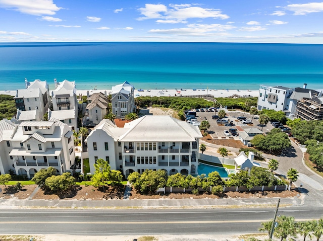 birds eye view of property with a view of the beach and a water view