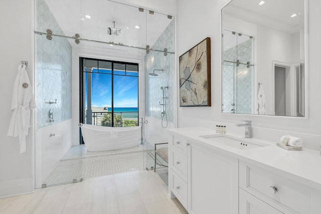 bathroom featuring vanity and independent shower and bath