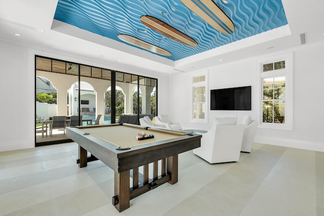 playroom with a raised ceiling and billiards